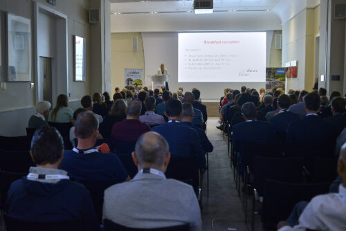 A full lecture room watching a presentation before the 2019 Parliamentary Bike Ride