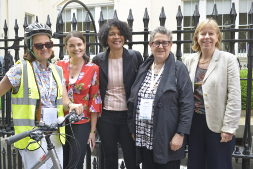 Five women, MPs and campaigners, posing together before the 2019 Parliamentary Bike Ride