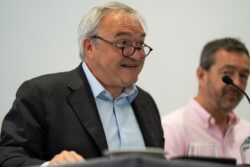 A man in glasses speaking at a panel table at the 2023 Parliamentary Bike Ride event